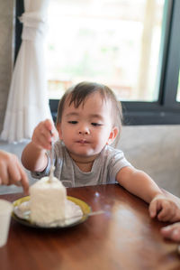 Girl having cake at home