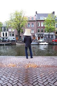Full length of man standing on street in city