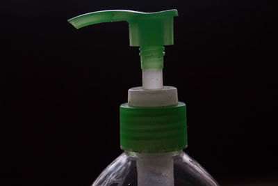 Close-up of bottle against black background