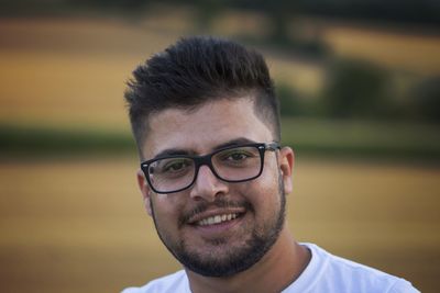 Close-up portrait of young smiling man