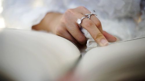 Close-up of woman holding hands