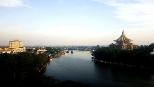 River in city against sky