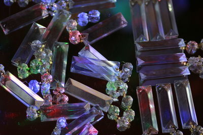 Close-up of various flowers in glass on table