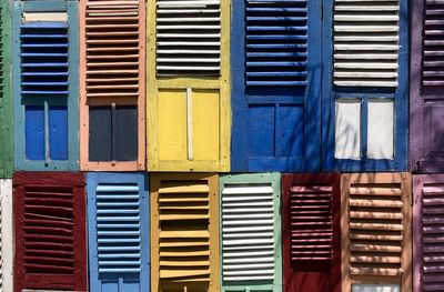 Full frame shot of multi colored windows of building