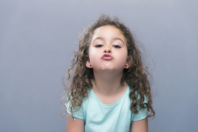 Portrait of girl against white background