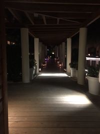 Illuminated underground walkway at night