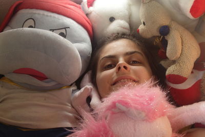 Close-up portrait of girl with toy