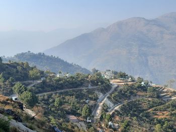 High angle view of trees and mountains against sky