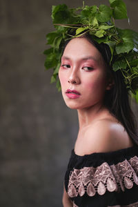 Portrait of a beautiful young woman looking away