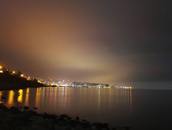 Scenic view of sea against sky at night