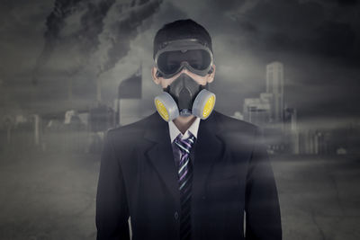 Portrait of businessman wearing gas mask