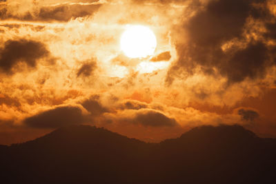 Low angle view of dramatic sky during sunset