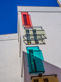 Low angle view of built structure against blue sky