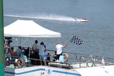 People on boat sailing in sea