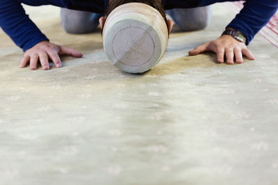 Midsection of man working on table