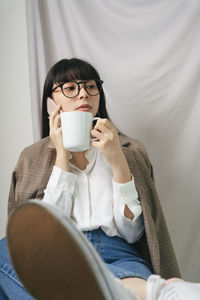 Portrait of man drinking coffee