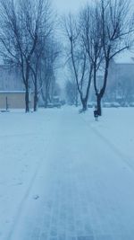 Road passing through snow covered landscape