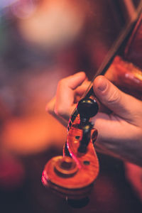 Cropped hand playing violin