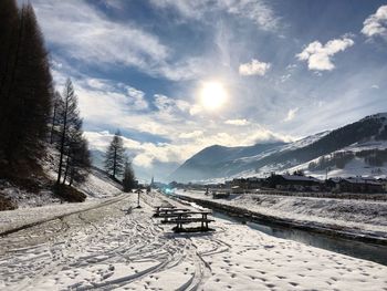 Scenic view of snow covered mountains against sky