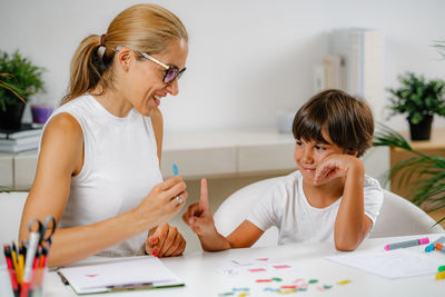 Child recognizing numbers in a preschool assessment test.