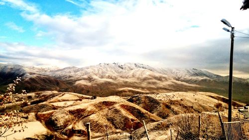 Scenic view of snowcapped mountains against sky