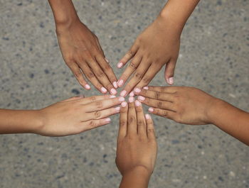 High angle view of hands on beach