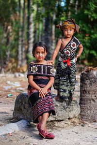 Portrait of 2 children wearing traditional clothes of sabu island indonesiato attend the festival 