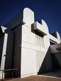 Low angle view of building against blue sky