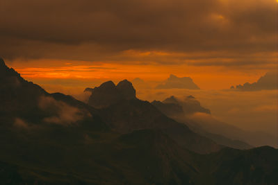 Scenic view of mountains against sky during sunset