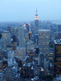 Illuminated cityscape against sky