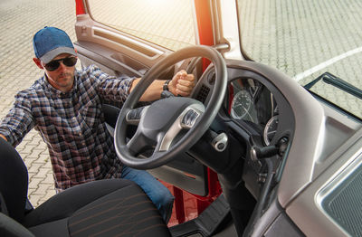 Portrait of man driving car