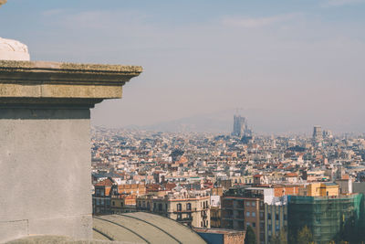 Observation platform with binoculars overlooking sagrada de familia in barcelona
