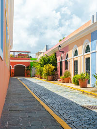 San juan puerto rico el morro street of bricks on a corner with colored walls and doors