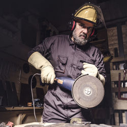 Portrait of manual worker working in workshop