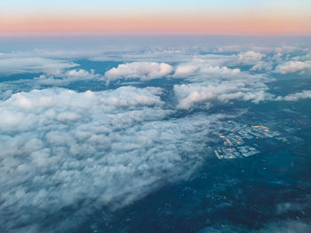 Aerial view of clouds against the sky during sunrise