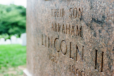 Close-up of text on cemetery