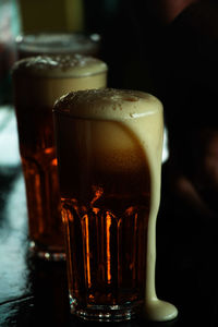 Close-up of beer glass on table