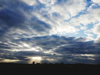 Scenic view of silhouette landscape against sky at sunset