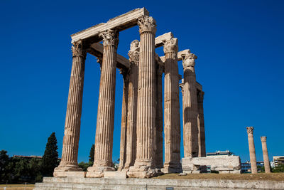 Ruins of the temple of olympian zeus also known as the olympieion and the acropolis in athens 
