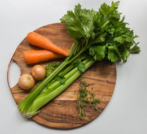 High angle view of vegetables on cutting board