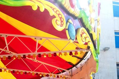 Low angle view of carousel in amusement park