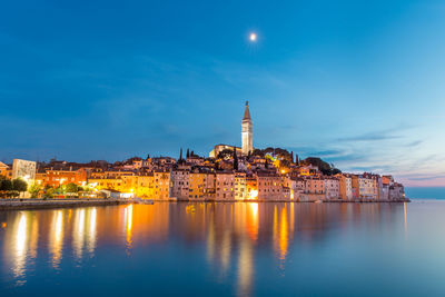 Illuminated buildings in city at night