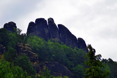 Low angle view of rocks against sky