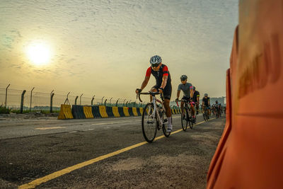 Man riding bicycle on road