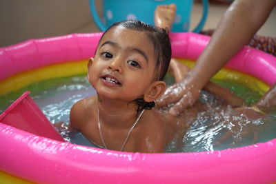 High angle view of boy swimming in water