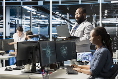 Man using laptop at office