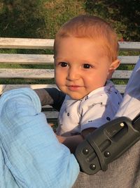 Portrait of cute baby girl sitting on floor