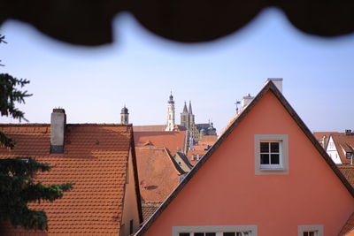 Houses against sky in city