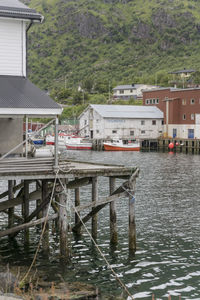 Bridge over river amidst houses and buildings