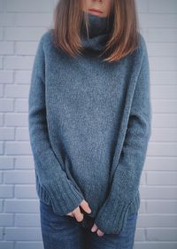 Midsection of woman standing against wall